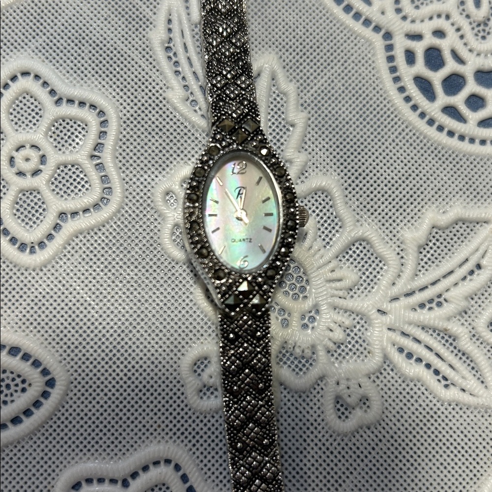VTG Penmans Women’s silver- tone watch with Marcasite  stones around the bezel